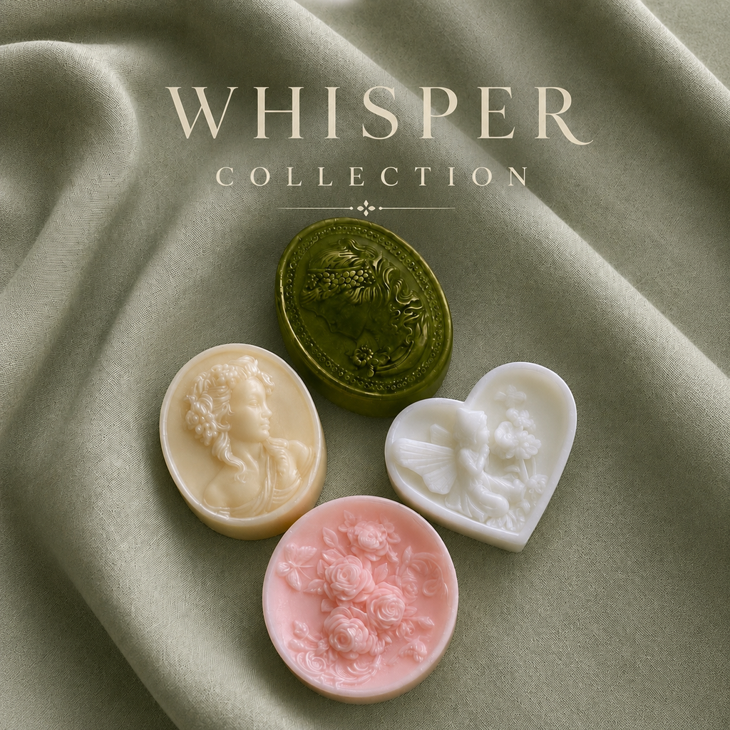 Elegant cameo and floral handmade soaps on soft neutral fabric by Soap&Box