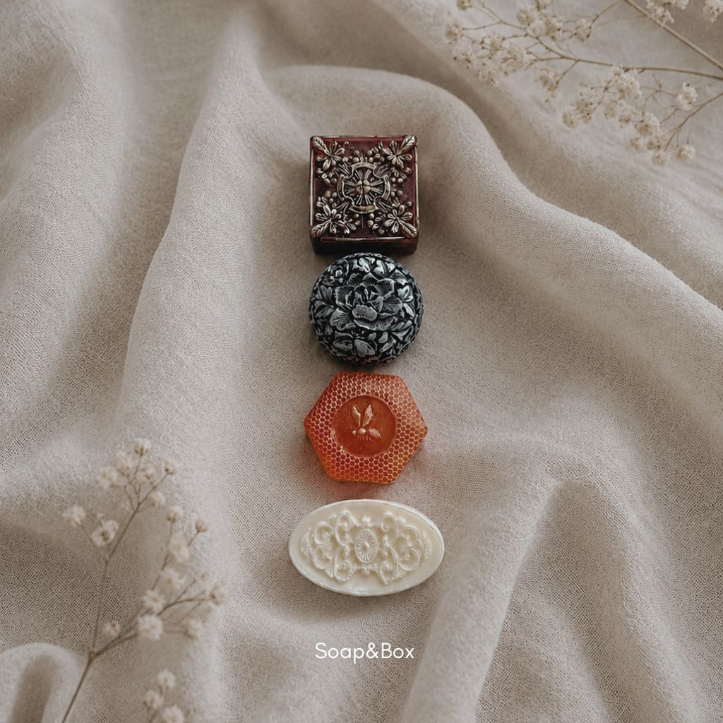 Artisan handmade soaps styled on soft fabric background in neutral tones